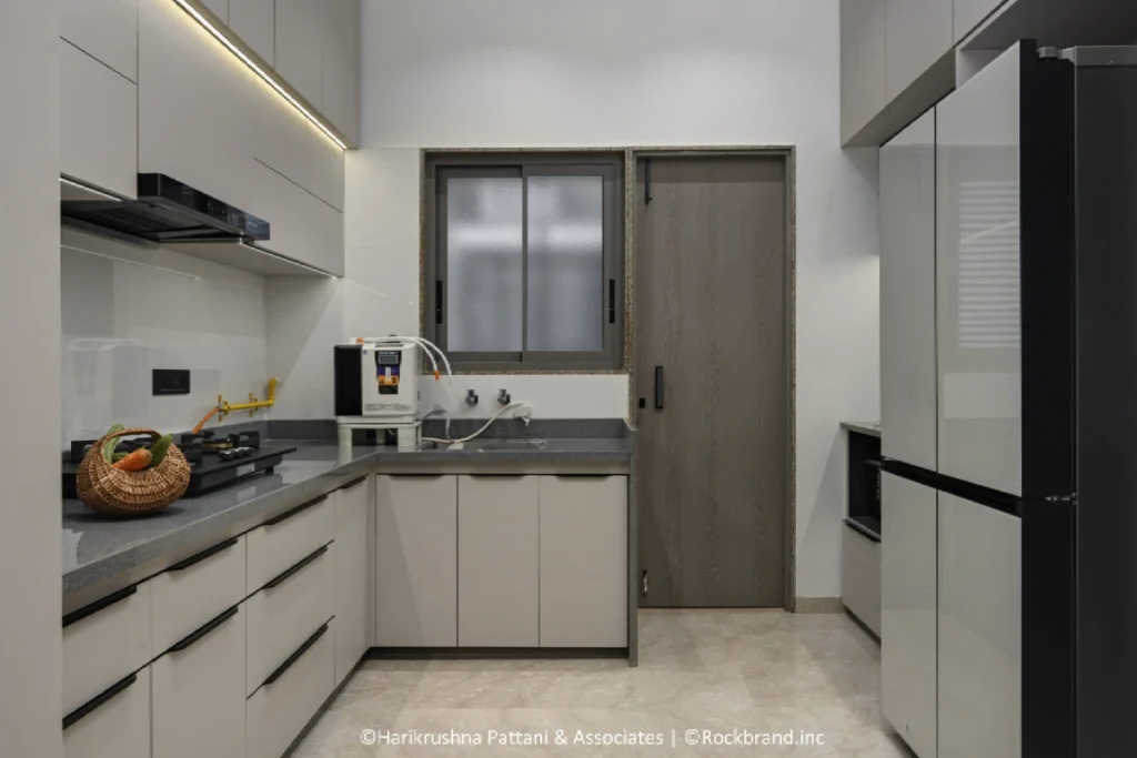 Grey and white modular kitchen design in Sharanya Skyvue 4 BHK apartment Ahmedabad